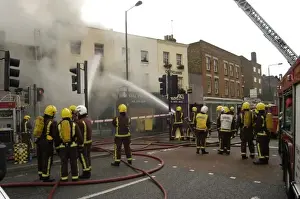 Firefighters at scene of fire, Stockwell Road, Brixton
