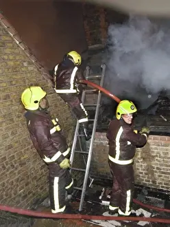 Firefighters at the scene of a school fire, SE London
