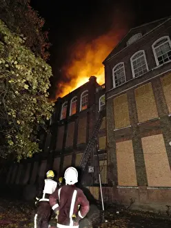 Reflective Prints: Firefighters at the scene of a school fire, SE London