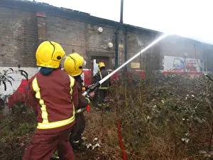 Firefighters at the scene of a warehouse fire, SE London