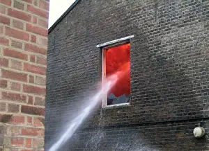 Firefighters at the scene of a warehouse fire, SE London