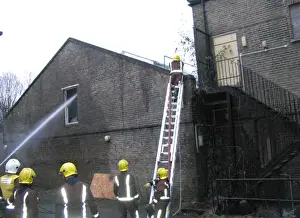 Firefighters at the scene of a warehouse fire, SE London