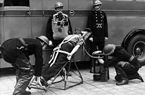 Rocking Prints: Firefighters in training with resuscitation stretcher