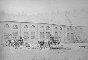 Images Dated 9th November 2011: Firefighters winding up their hoses