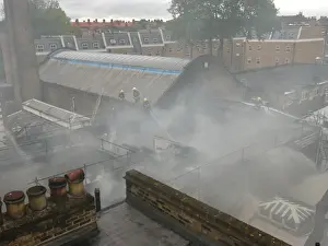 Firefighters working at scene of commercial fire