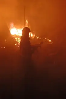Firefighters working at scene of fire in Carshalton, Surrey