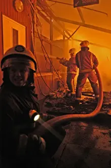 Firefighters working at scene of fire in Carshalton, Surrey