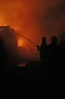 Firefighters working at scene of fire in Carshalton, Surrey
