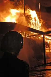 Firefighters working at scene of fire in Carshalton, Surrey
