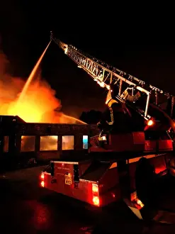 Firefighters working at scene of pub fire, SE London