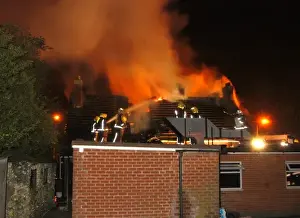Firefighters working at scene of restaurant fire