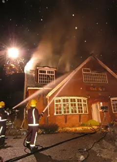 Firefighters working at scene of restaurant fire