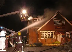 Firefighters working at scene of restaurant fire