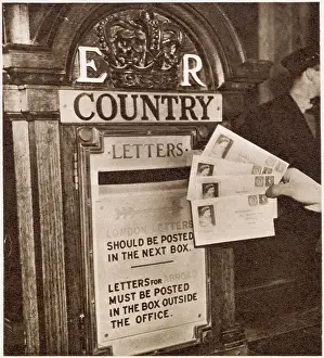 Posted Prints: Some of the first letters to bear the stamps of the new reign of Queen Elizabeth II being posted at the General Post