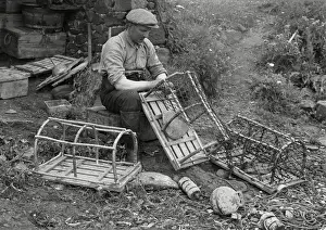 Fisherman repairing lobster pots