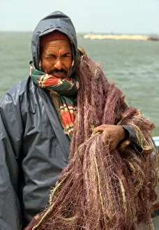 Tunisian Collection: A fisherman wearing oilskins. Djerba, Tunisia