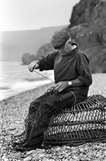 Pebble Gallery: Fisherman, wicker lobster pot, Seaton