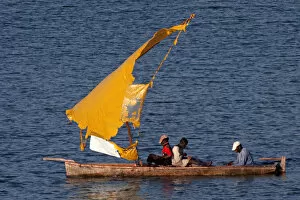 Images Dated 1st March 2011: Fishermen - in boat with torn sail