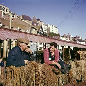 Brixham Prints: Two fishermen in Brixham Harbour, Devon
