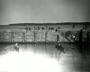 Angling Gallery: Fishing from a harbour wall, India