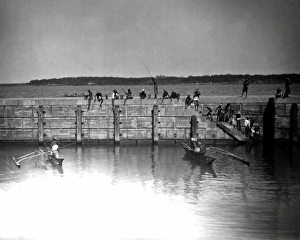 Angling Gallery: Fishing from a harbour wall, India