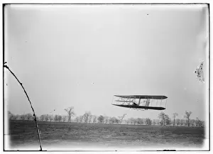 Dayton Prints: Flight 85: Orville in flight over treetops, covering a dista