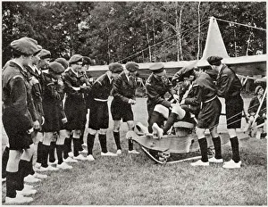 Cadets Prints: Flt.Lieut. Wilson helping to adjust the equipment of the pilot as one of the boys prepares to take off in a glider