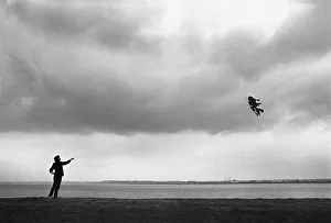 Images Dated 2nd July 2019: Flying a Chinese kite on the banks of the River Mersey