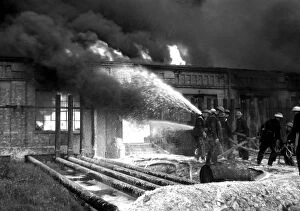 Damage Gallery: Foam applied at oil tank fire, Thames Haven, WW2