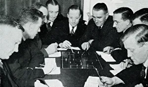Rules Prints: Football referees studying the rules of the game