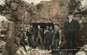 The foreman and miners pose for a photograph