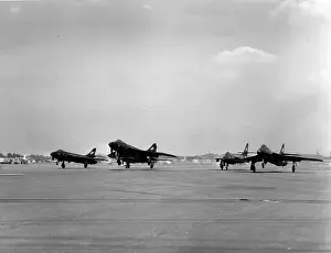 Glossy Prints: Formation take-off of the glossy all-black Hawker Hunters