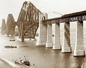 The Forth Railway Bridge with ferry and steam train