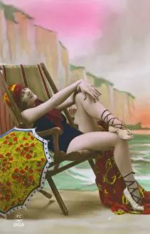 France - Jolly girl in a bathing costume on a deckchair