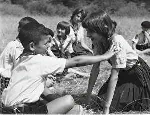 French cub scouts, boys and girls, with leader