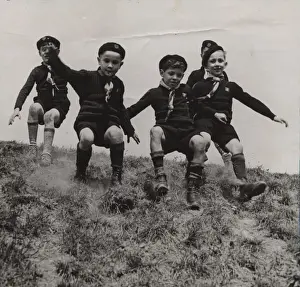 Sliding Prints: French cub scouts sliding down a slope