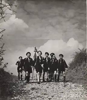 French cub scouts walking along a country lane