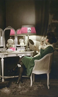 Lamp Collection: French lady getting ready to go out in her boudoir