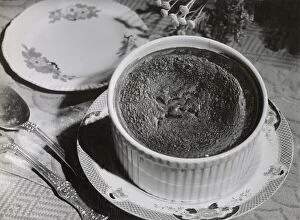 Prepared Collection: A freshly made chocolate souffle, temptingly and decoratively arranged on a table