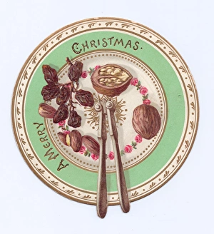 Images Dated 3rd December 2015: Fruit and nuts on a plate on a cutout Christmas card