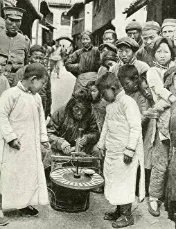 Chance Gallery: Gambling for sweets at roulette wheel, China, East Asia