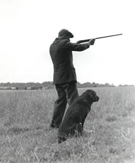 Shotgun Gallery: Gamekeeper with dog and gun
