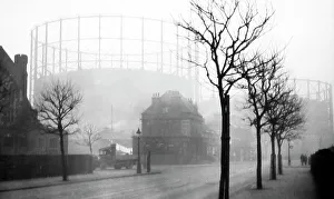 Gasometer Prints: Gasometers in the early morning mist, probably 1920s