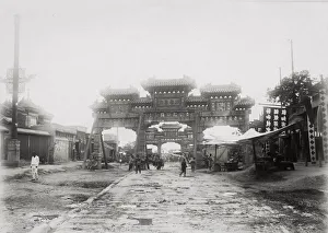 Gate and street, likely Peking, Beijing, China