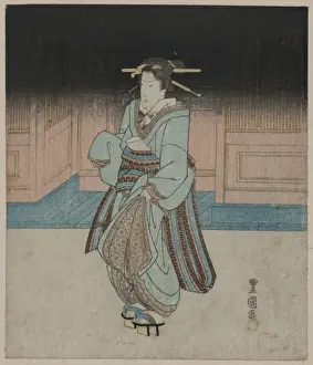 A geisha on an evening stroll in Fukagawa