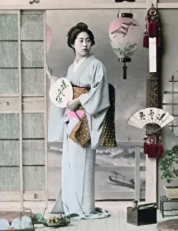 Geisha with fan, Japan, circa 1890
