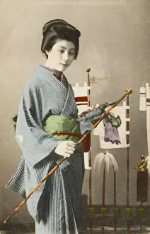 Geisha holding decorative fish flag