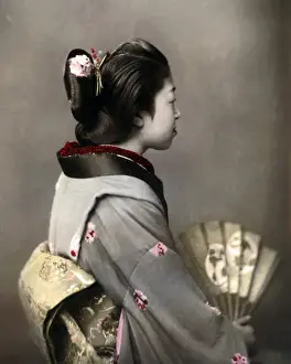 Geishas Prints: Geisha with obi sash and fan, Japan