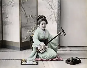 Samisen Prints: Geisha playing a samisen, Japan, circa 1890