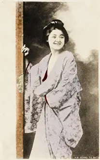 Geisha smiling on way to the bath